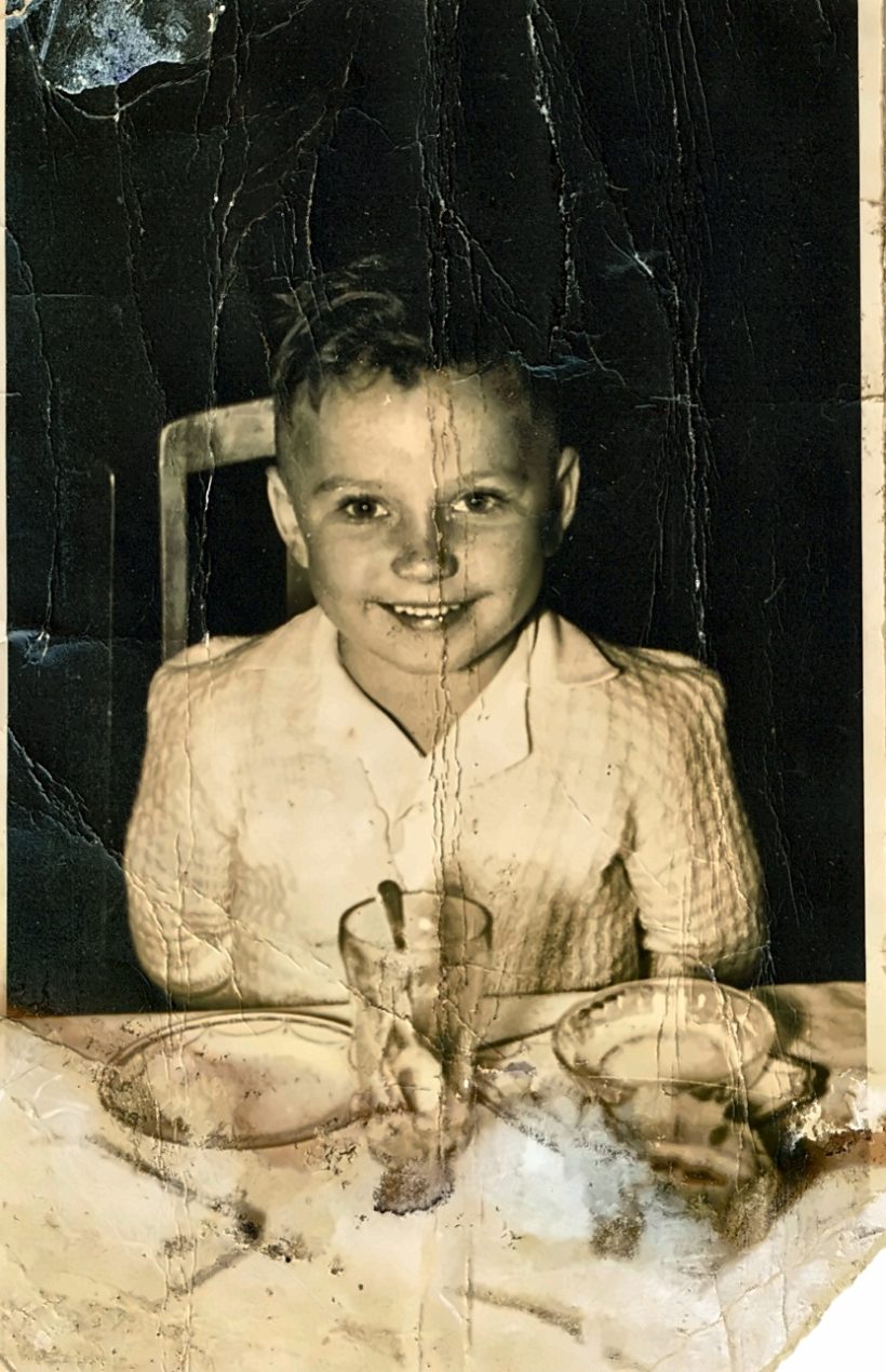 the same portrait before restoration, cracked and faded